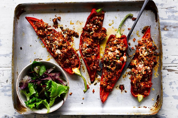 Four Romano red peppers filled with sausage meat