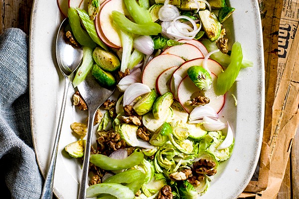 Waldorf Salad Recipe with Brussels Sprouts served on a oval white serving dish
