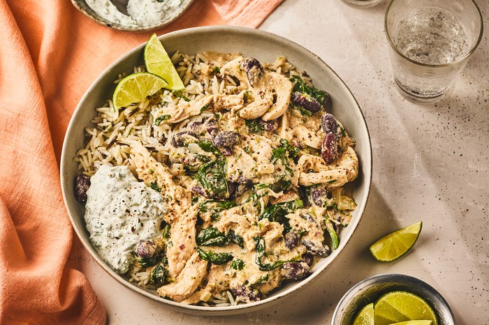 A whole dish of tahini chicken chilli with dip on the side