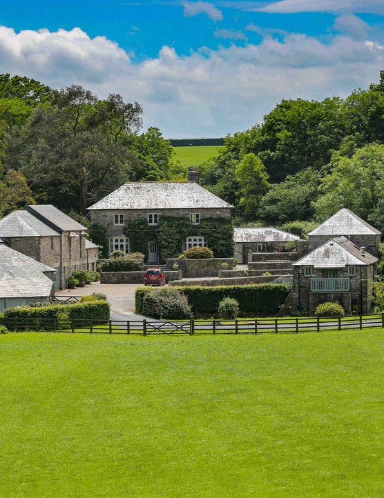 Farmhouse with bright green grass in front