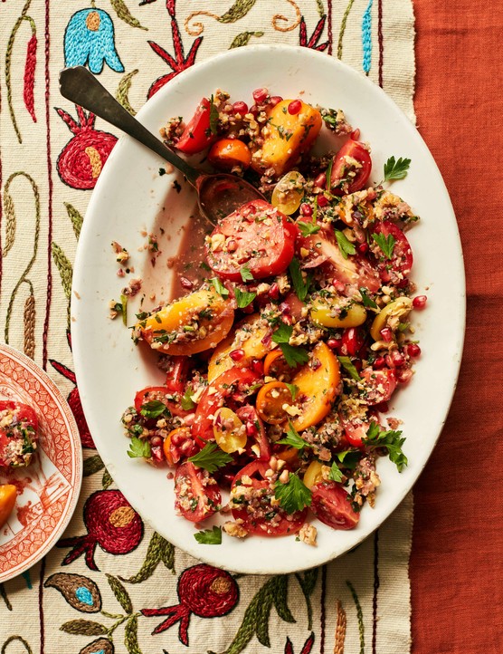 A large platter full of tomatoes