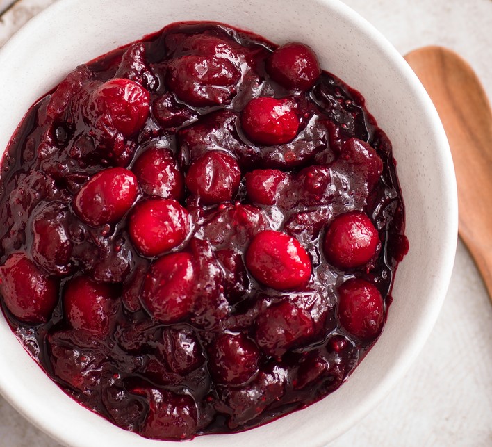 A small pot of cranberry sauce