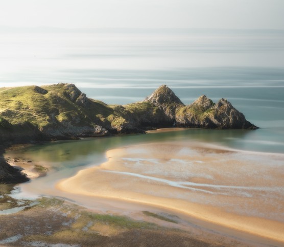 A calm day on the Gower Coast at the Three Cliffs Bay