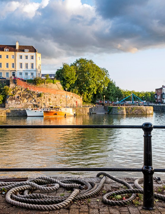 Bristol harbourside with the river and colourful houses in the background