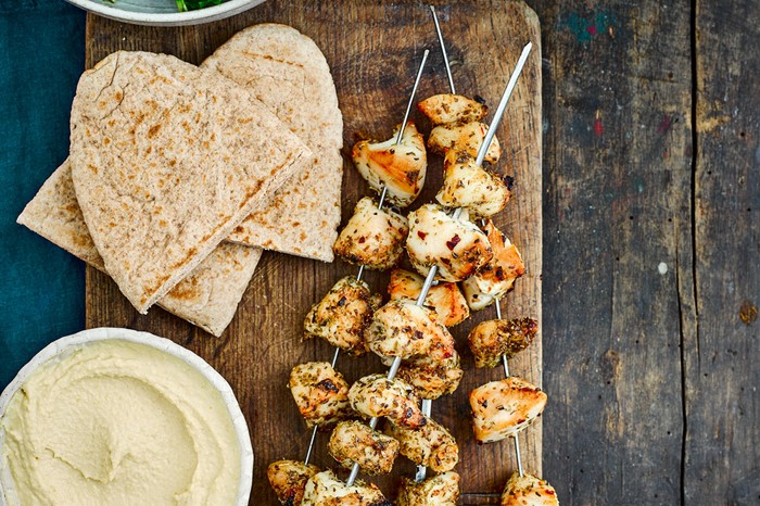 Herby chicken skewers with pitta flatbreads and sald