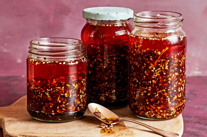 Three jars of homemade chilli crisp.