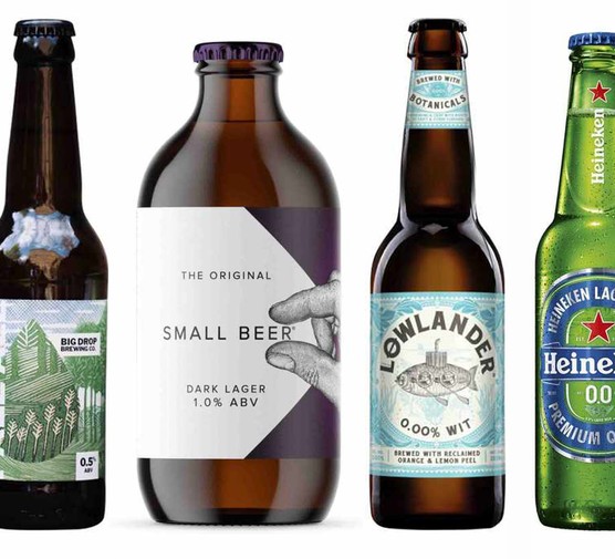 Four bottles of non alcoholic beers including a green Heineken bottle