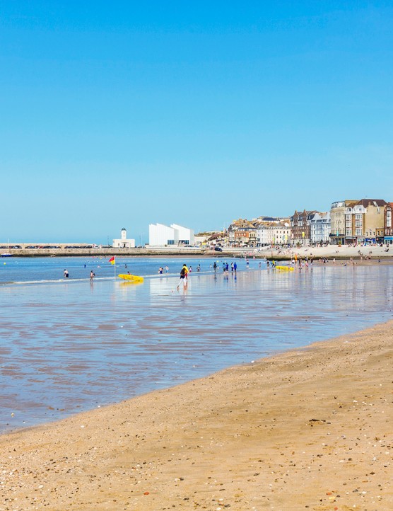 Margate beach sand and sea with buildings in the background