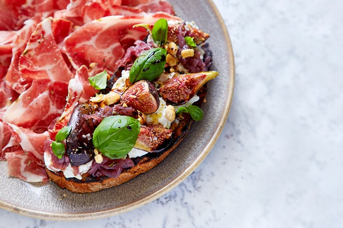 Bruschetta with cured ham on the side