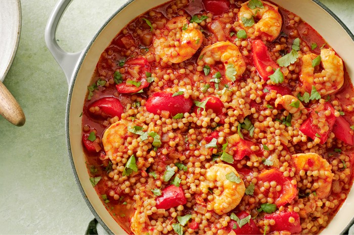 Harissa, pepper and prawn stew with giant couscous