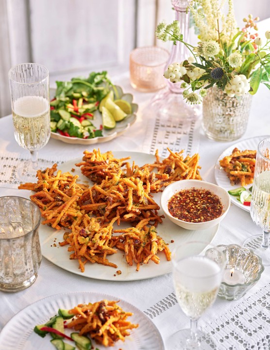 Sweet potato and cranberry fritters with nuoc cham on a serving plate