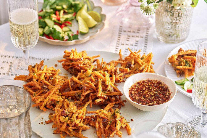 Sweet potato and cranberry fritters with nuoc cham on a serving plate
