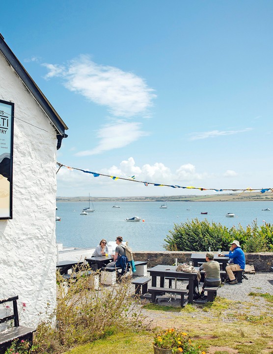 Outdoor seating at a pub overlooking the sea