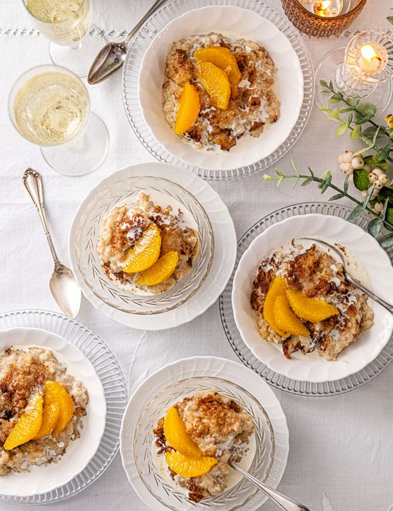 Bowls of homemade rice pudding topped with orange segments