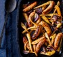 Sausage, pear, parsnip and red onions in a baking tray