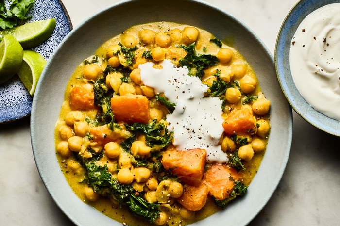Slow cooker sweet potato, chickpea and coconut one-pot in a shallow bowl