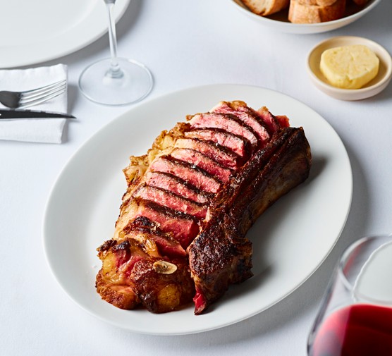 Close-up of steak on a white dinner plate