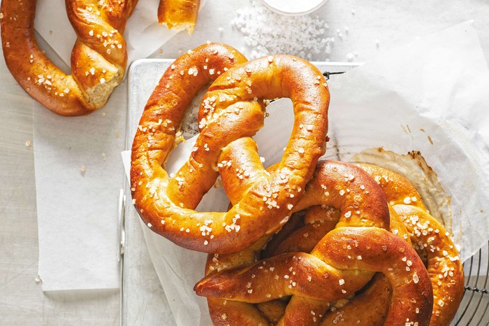 A pile of soft pretzels dusted with salt