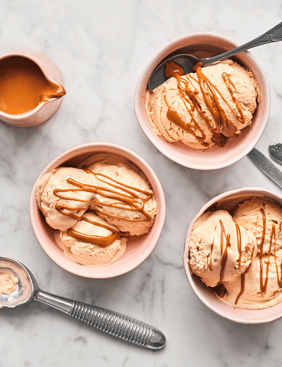Bowls of biscoff ice cream with melted biscoff drizzed on top