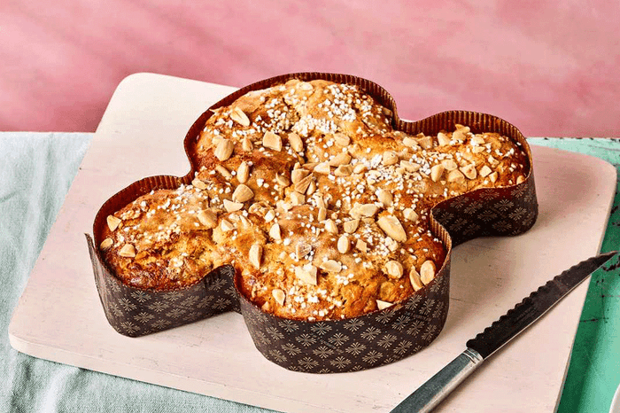 Italian Easter cake in dove mould on a pink background