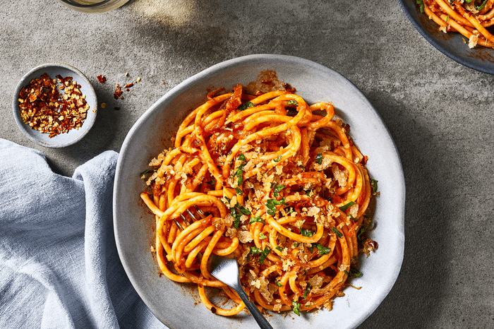 Bowl of anchovy spaghetti on a tabletop