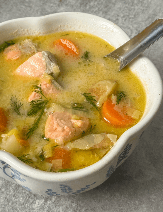 Finnish salmon soup in a white bowl